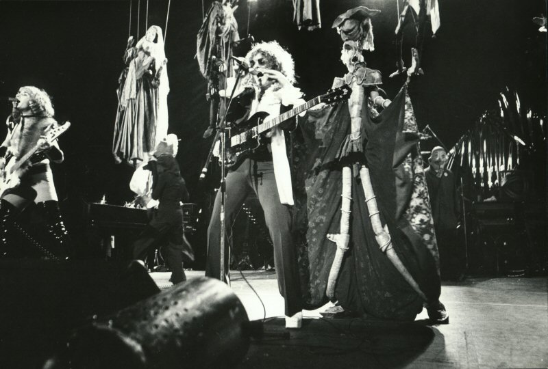 Ian Hunter on stage with marionettes